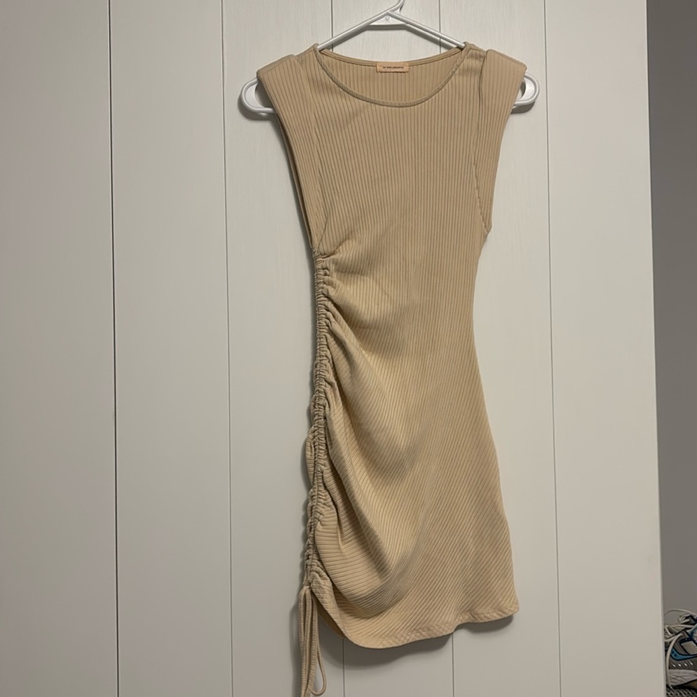 Shoulder padded cream body con mini dress